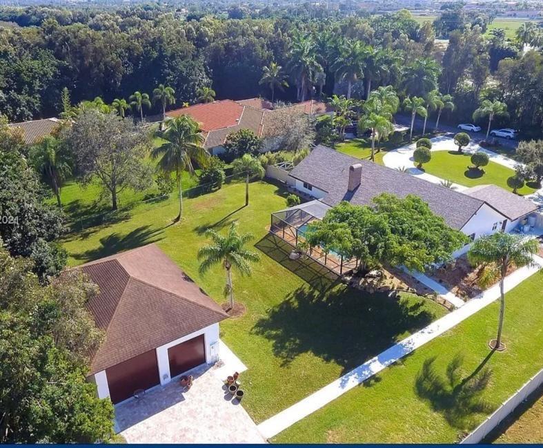 6530 Southwest 172nd Avenue Southwest Ranches, FL 33331 - Photo 2 of 42 an aerial view of a house with a garden