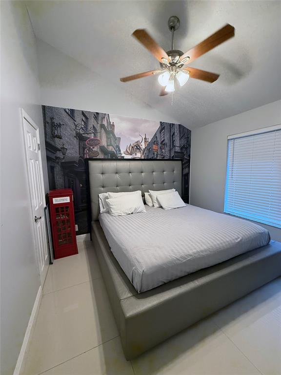 6530 Southwest 172nd Avenue Southwest Ranches, FL 33331 - Photo 24 of 42 a bedroom with a bed and a ceiling fan