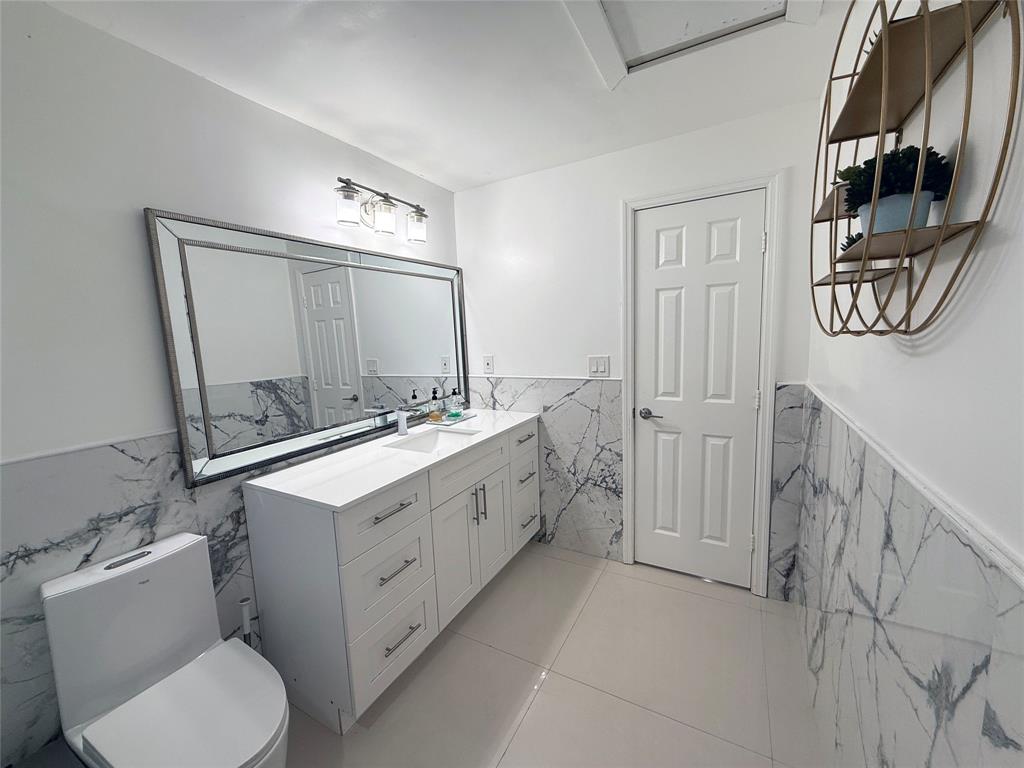 6530 Southwest 172nd Avenue Southwest Ranches, FL 33331 - Photo 26 of 42 a bathroom with a double vanity sink mirror and toilet