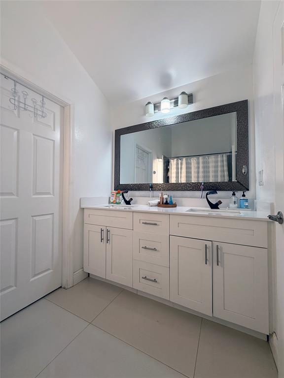 6530 Southwest 172nd Avenue Southwest Ranches, FL 33331 - Photo 27 of 42 a bathroom with a double vanity sink and mirror