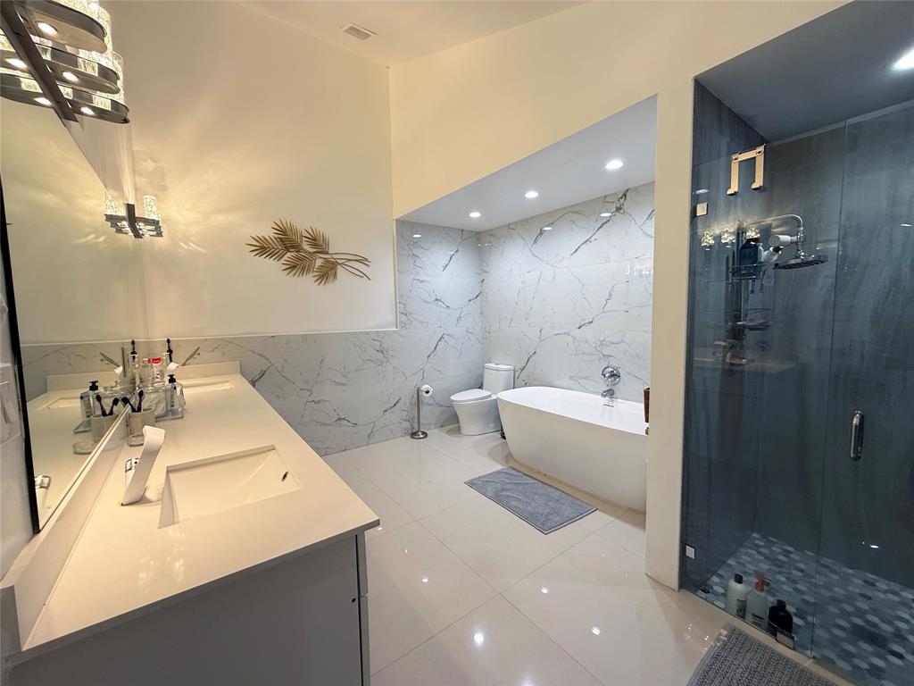 6530 Southwest 172nd Avenue Southwest Ranches, FL 33331 - Photo 34 of 42 a bathroom with a tub sink shower and mirror