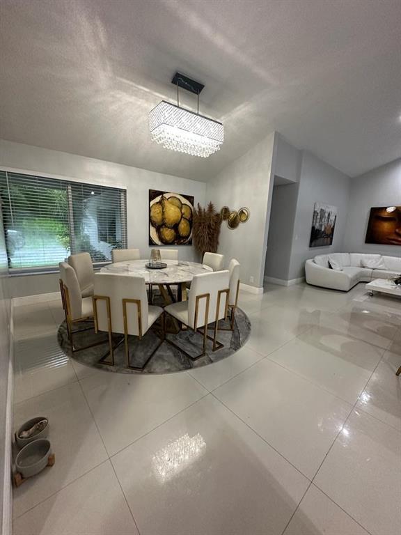 6530 Southwest 172nd Avenue Southwest Ranches, FL 33331 - Photo 6 of 42 a living room with furniture and a flat screen tv