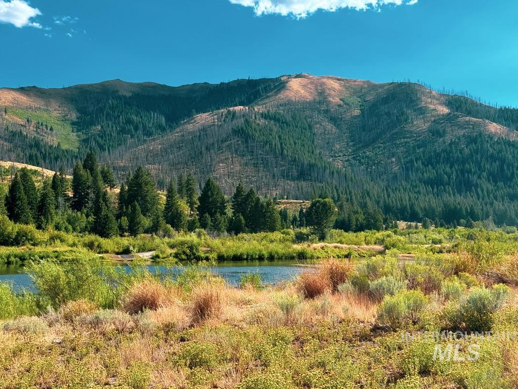 421 Deer Creek Road Hailey, ID 83333 - Photo 15 of 45 View of mountain background with a large body of water and a heavily wooded area