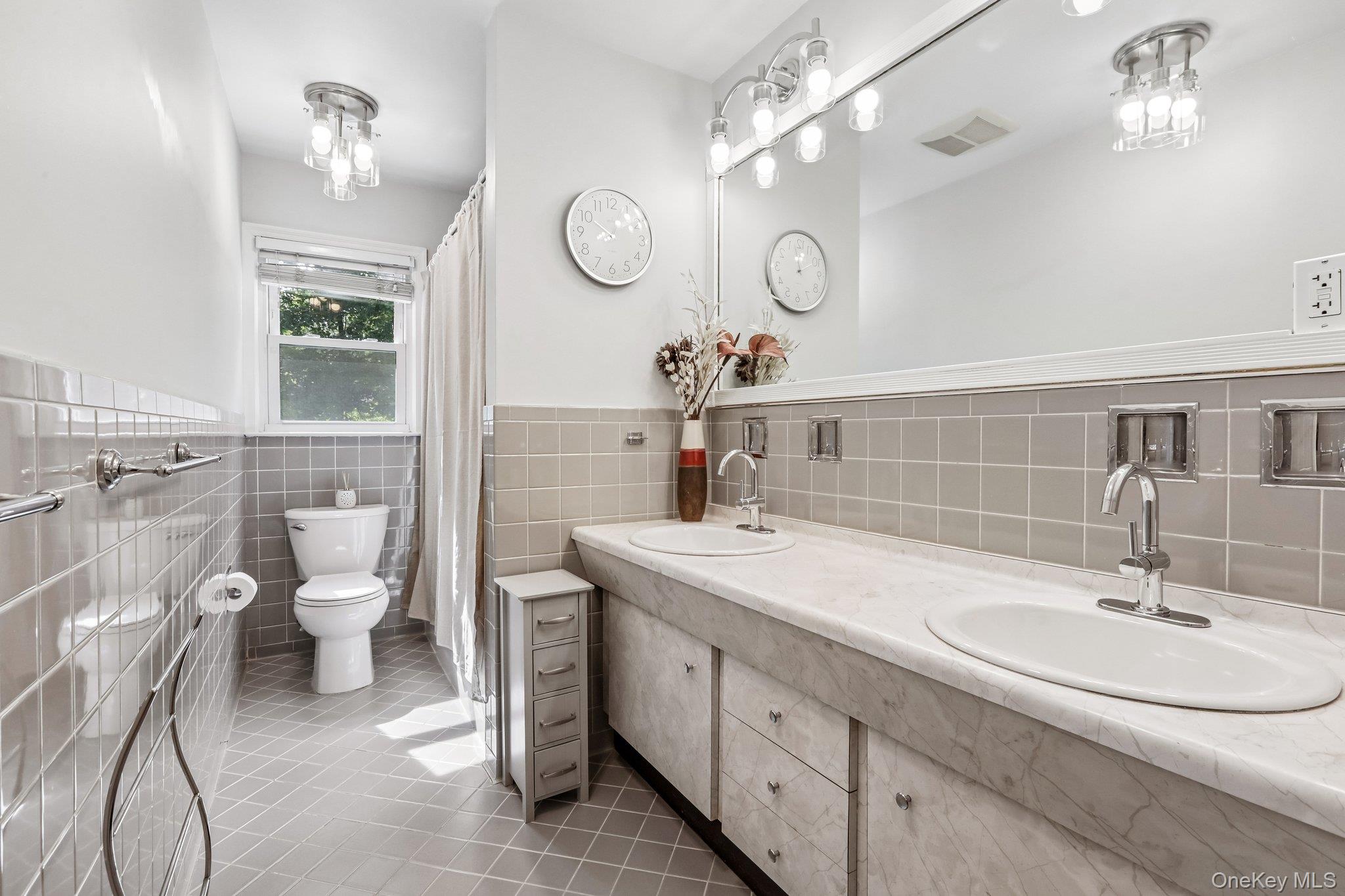 62 Mohegan Road Larchmont, NY 10538 - Photo 42 of 46 a bathroom with a toilet a sink and mirror