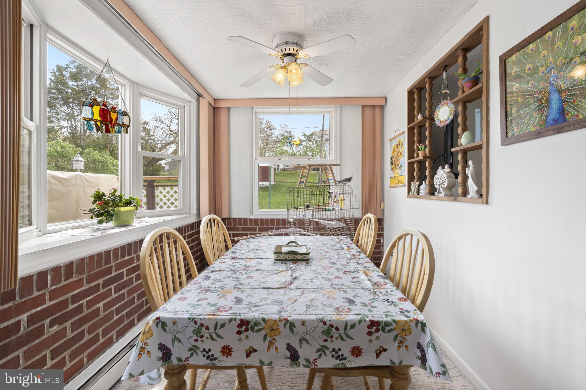 2940 Stoney Creek Road Norristown, PA 19401 - Photo 15 of 43 a view of a dining room with furniture a chandelier and wooden floor