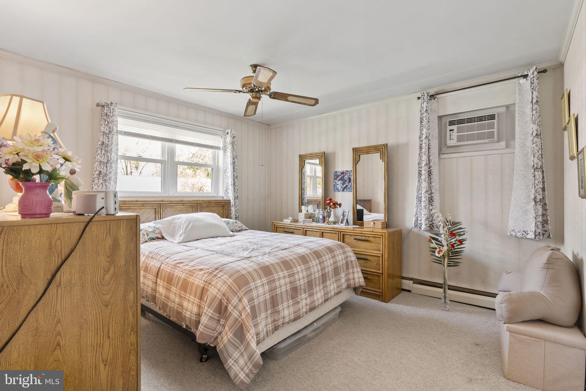 2940 Stoney Creek Road Norristown, PA 19401 - Photo 23 of 43 a bedroom with a bed a couch and dresser