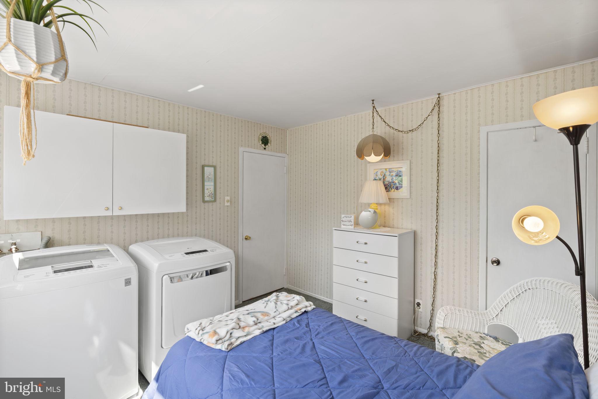 2940 Stoney Creek Road Norristown, PA 19401 - Photo 28 of 43 a bedroom with a bed and a chandelier