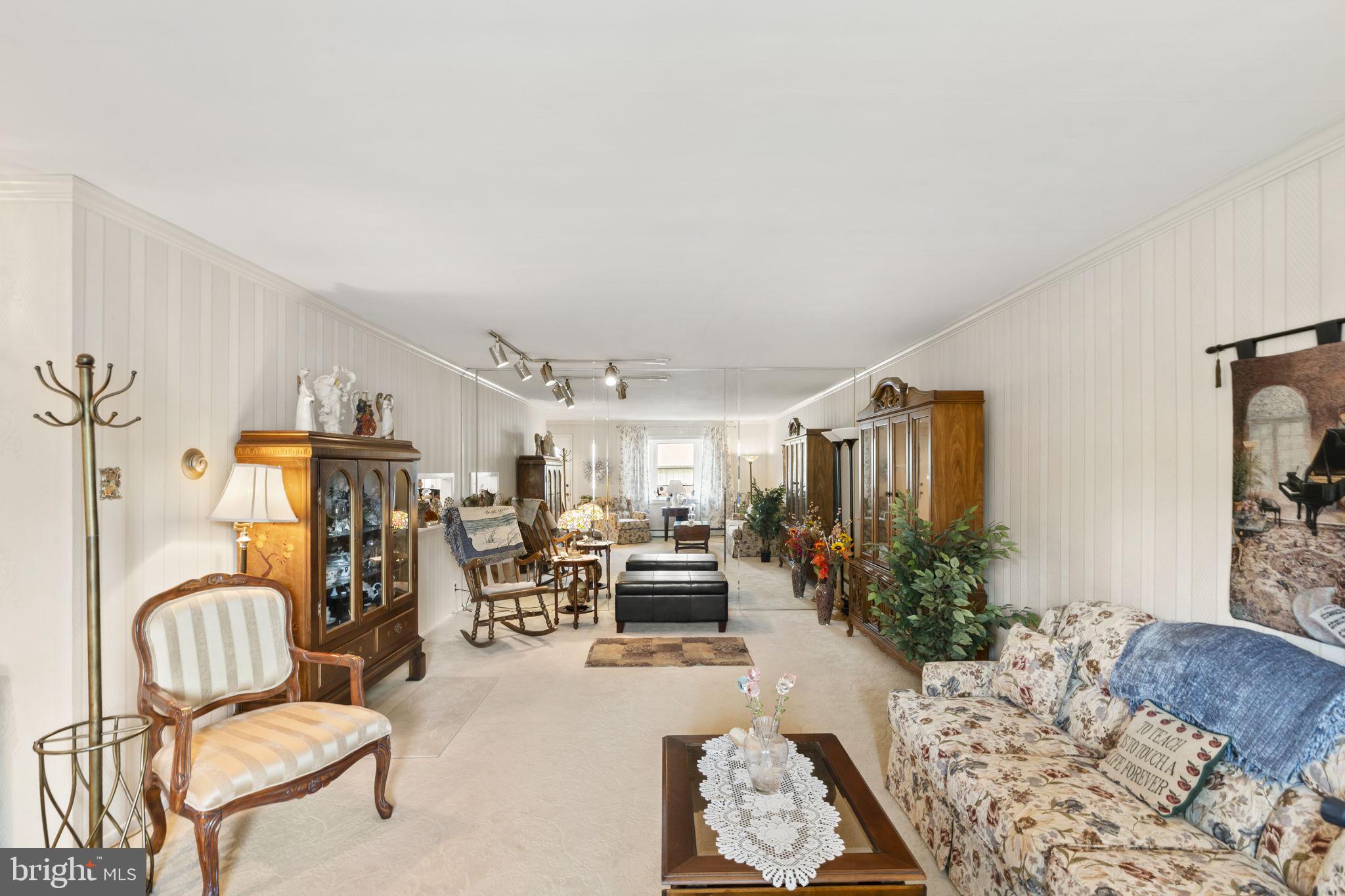 2940 Stoney Creek Road Norristown, PA 19401 - Photo 6 of 43 a living room with furniture kitchen view and wooden floor