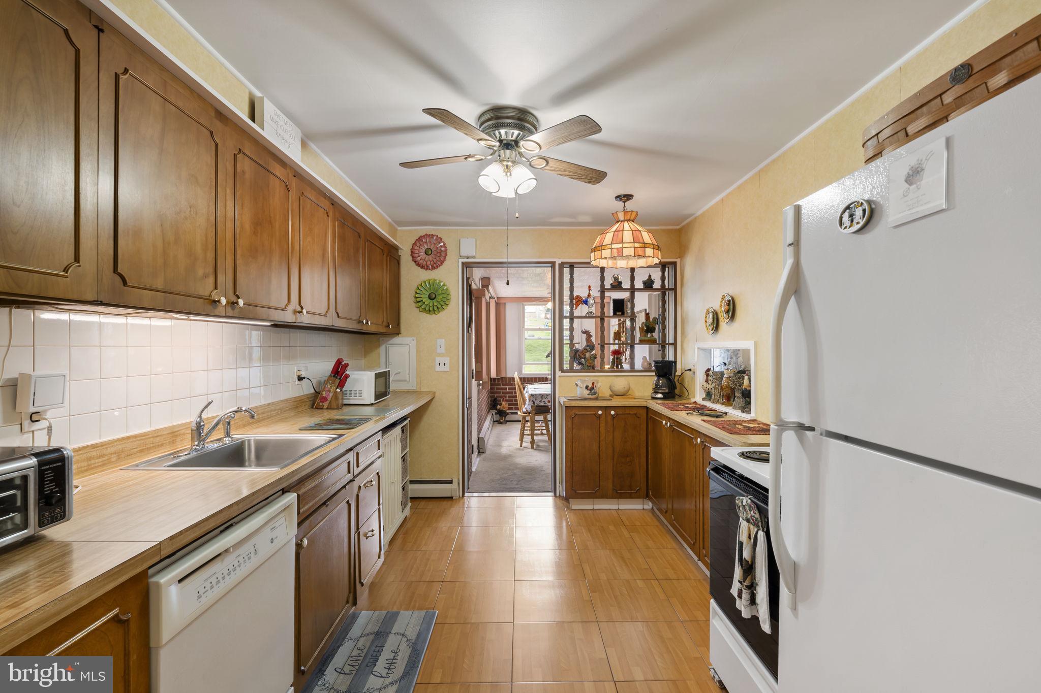 2940 Stoney Creek Road Norristown, PA 19401 - Photo 10 of 43 a kitchen with a sink appliances cabinets and furniture