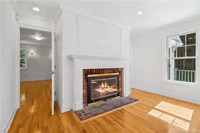 a living room with a fireplace and a table