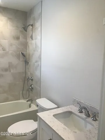 a bathroom with a sink toilet and bathtub