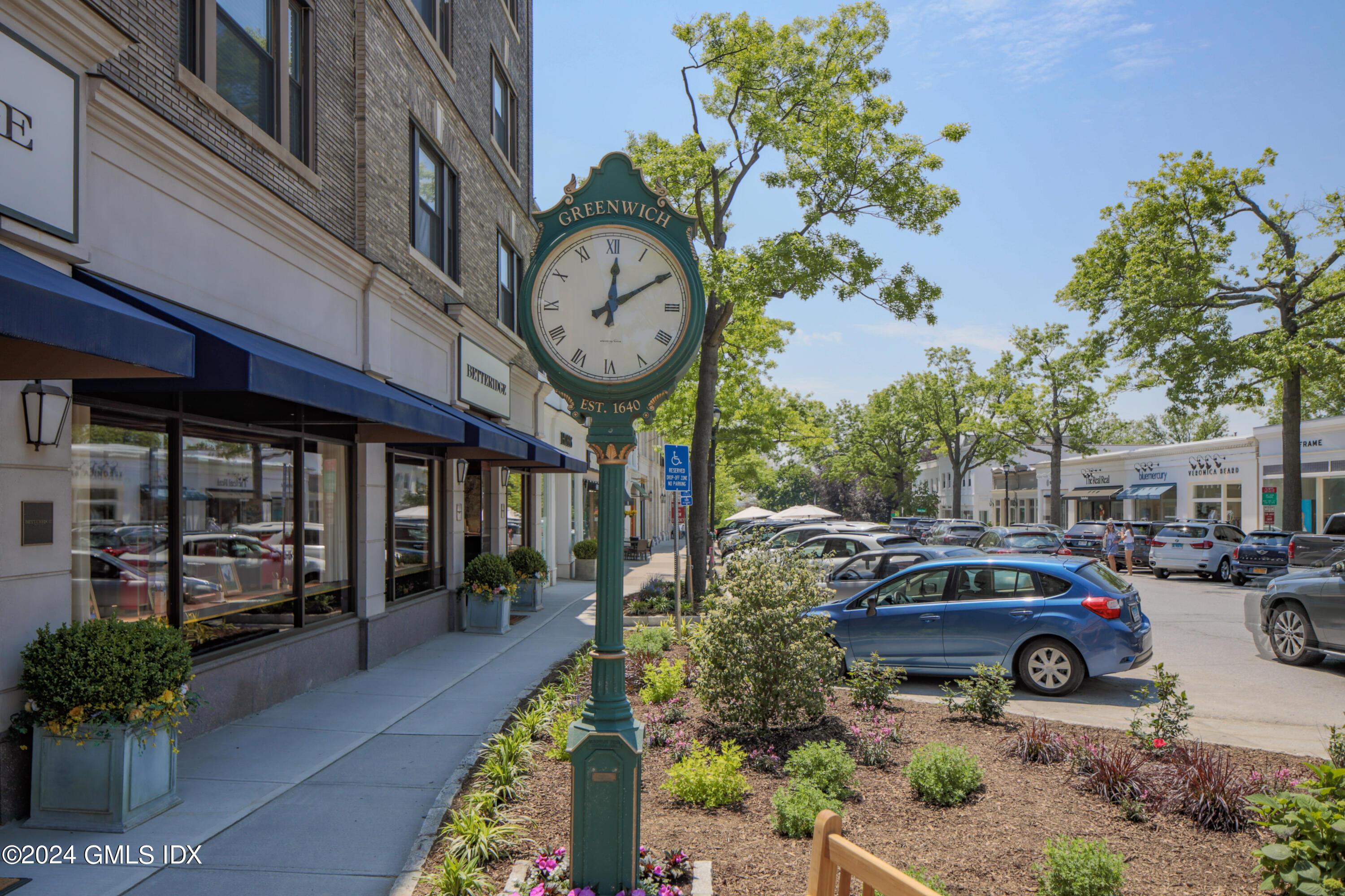 54 Greenwich Avenue, Unit 3 Greenwich, CT 06830 - Photo 25 of 30 a front view of a building with lots of trees and plants