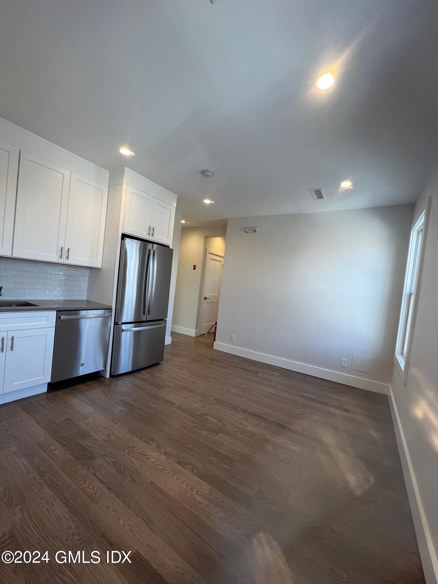 54 Greenwich Avenue, Unit 3 Greenwich, CT 06830 - Photo 7 of 30 a view of empty room with wooden floor