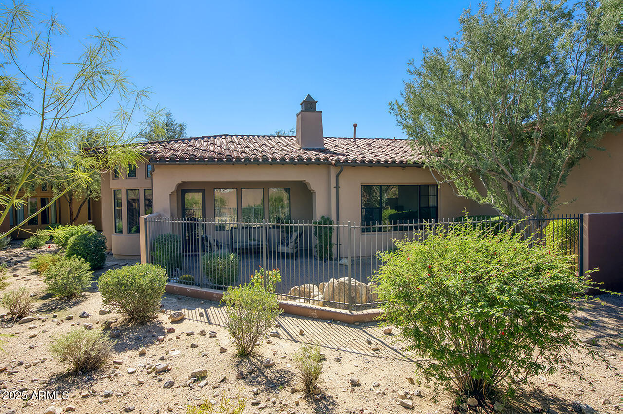 9190 East Hoverland Road Scottsdale, AZ 85255 - Photo 4 of 35 a front view of a house with garden