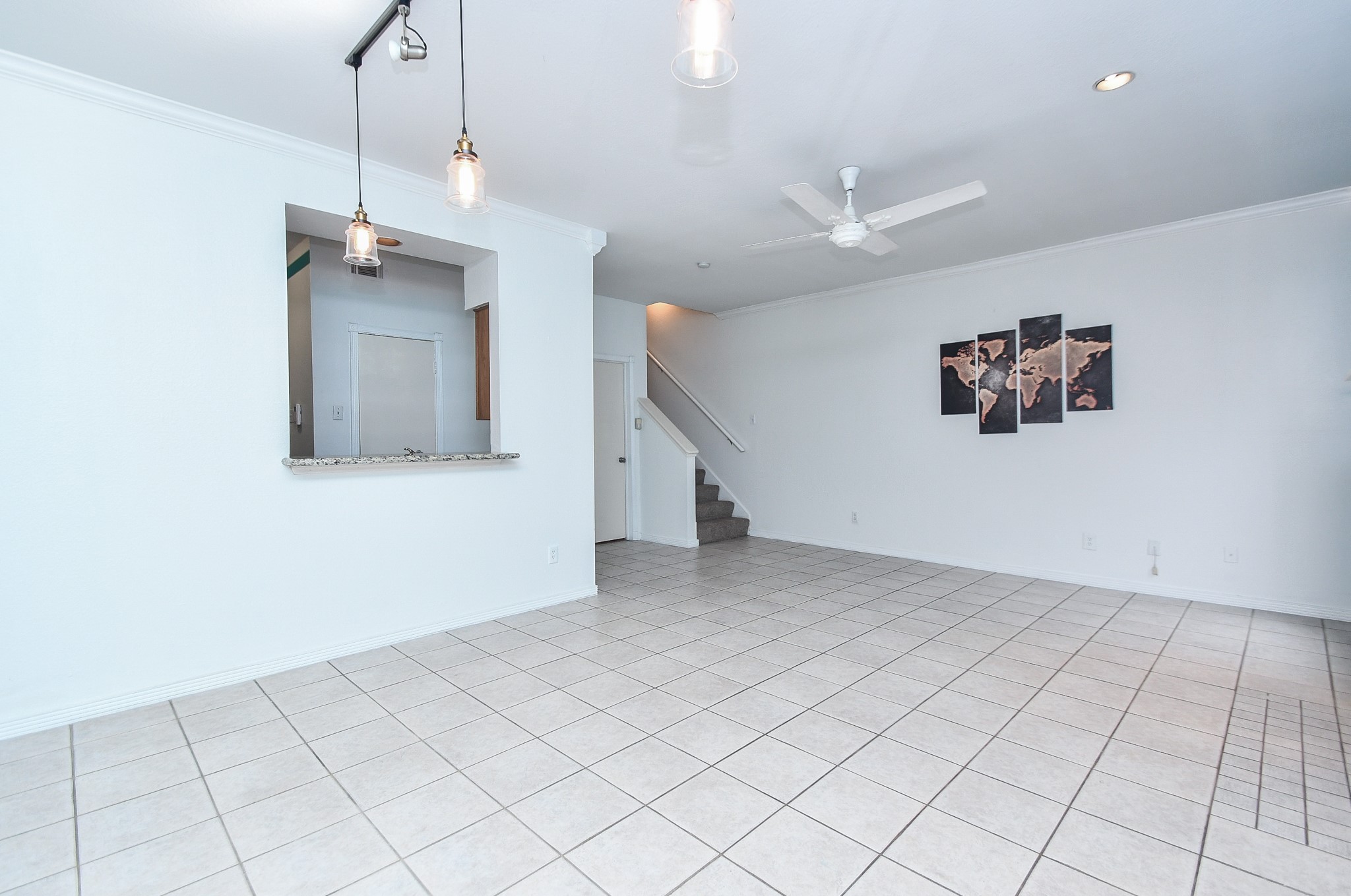 a view of a kitchen with cabinet and a hallway