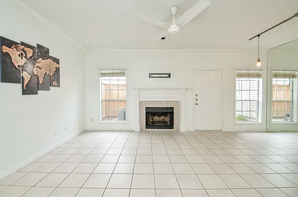a view of a big room with windows and cabinet