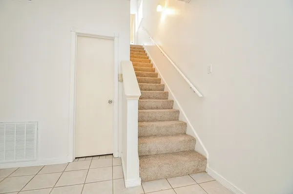 a backyard of a house with outdoor seating