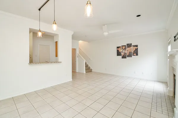 a view of a kitchen with cabinet and a hallway