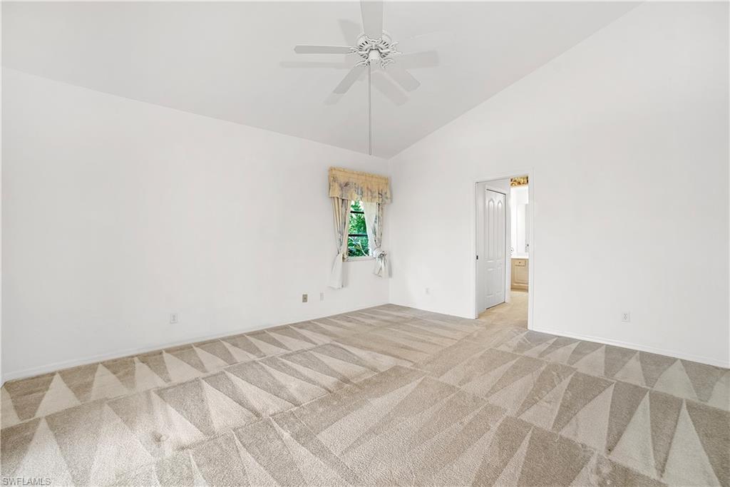 10969 Phoenix Way Naples, FL 34119 - Photo 11 of 20 a view of an empty room with a window