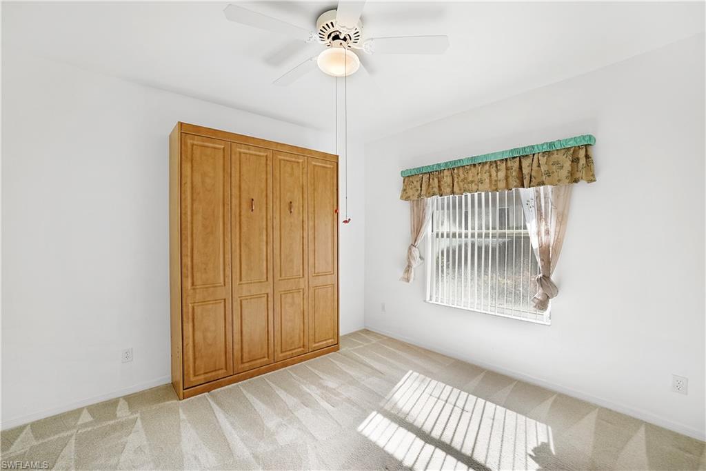 10969 Phoenix Way Naples, FL 34119 - Photo 13 of 20 a view of an empty room with a window