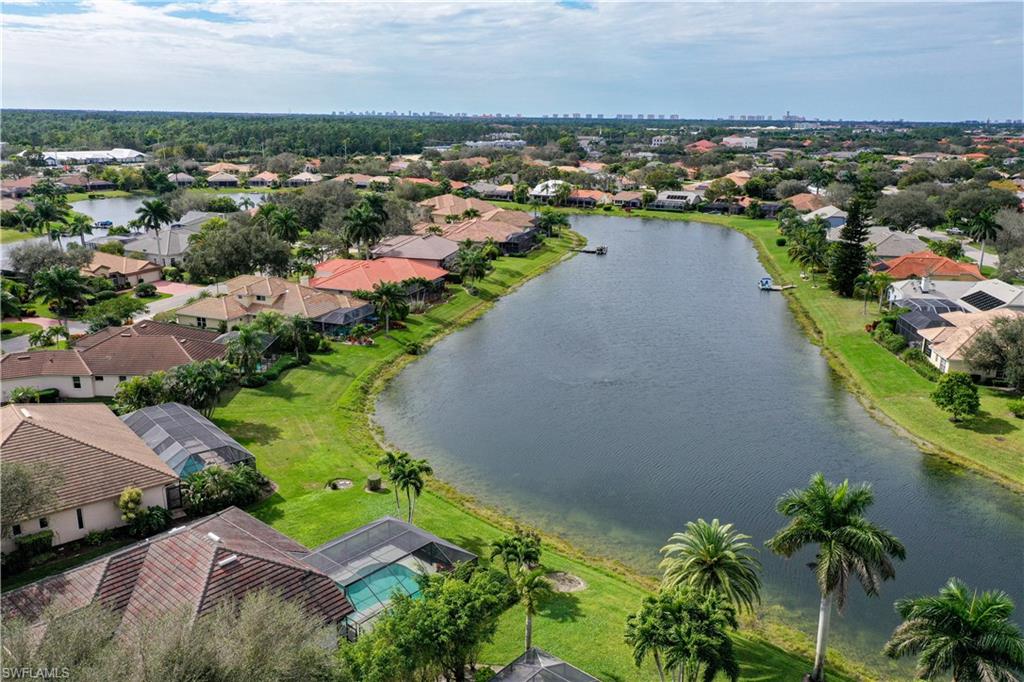 10969 Phoenix Way Naples, FL 34119 - Photo 18 of 20 an aerial view of a city with lots of residential buildings