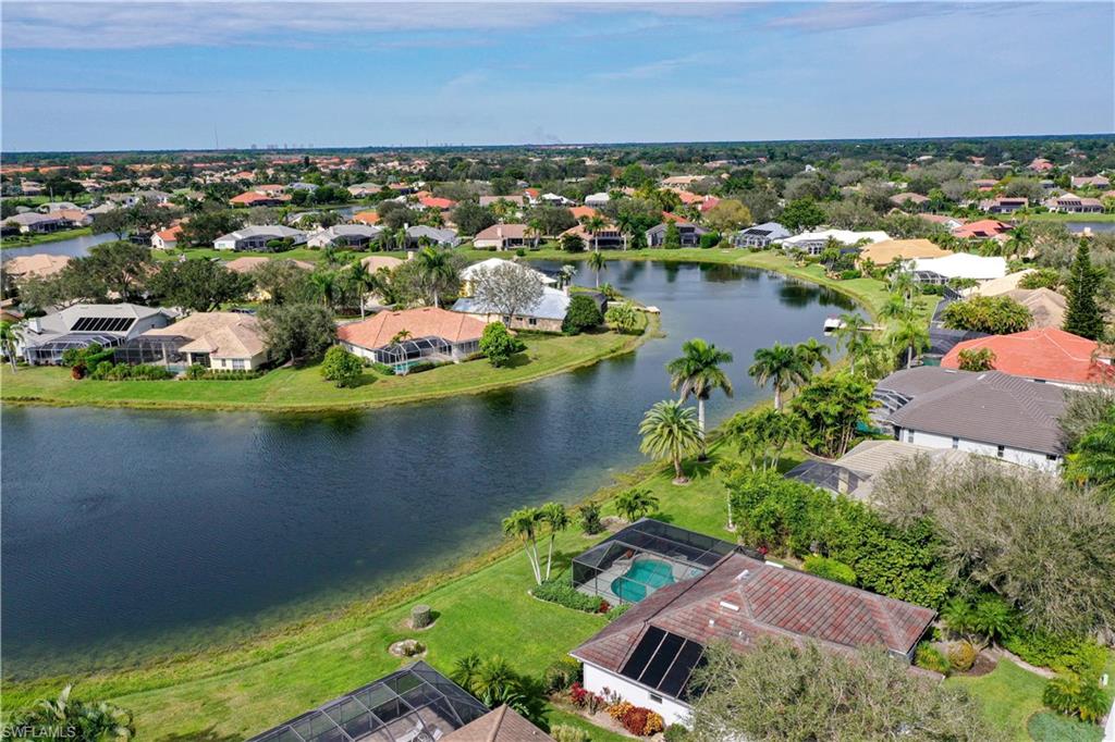 10969 Phoenix Way Naples, FL 34119 - Photo 19 of 20 an aerial view of residential houses with outdoor space and lake view