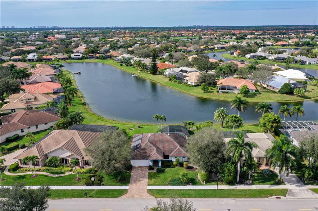 10969 Phoenix Way Naples, FL 34119 - Photo 2 of 20 an aerial view of a house with a yard
