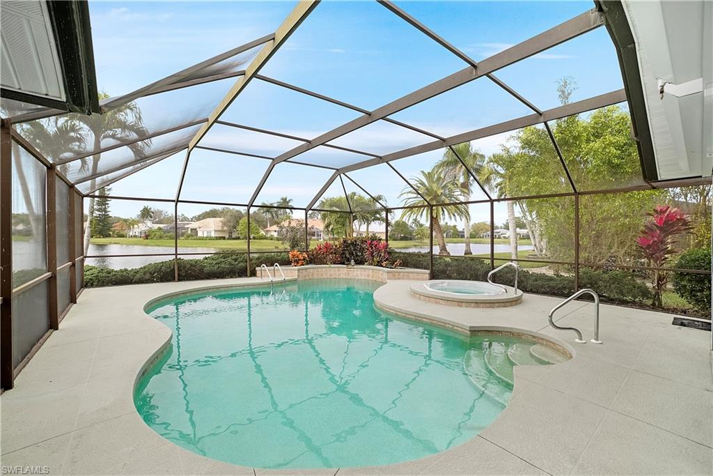 10969 Phoenix Way Naples, FL 34119 - Photo 3 of 20 a view of a dining room with furniture wooden floor and a potted plant