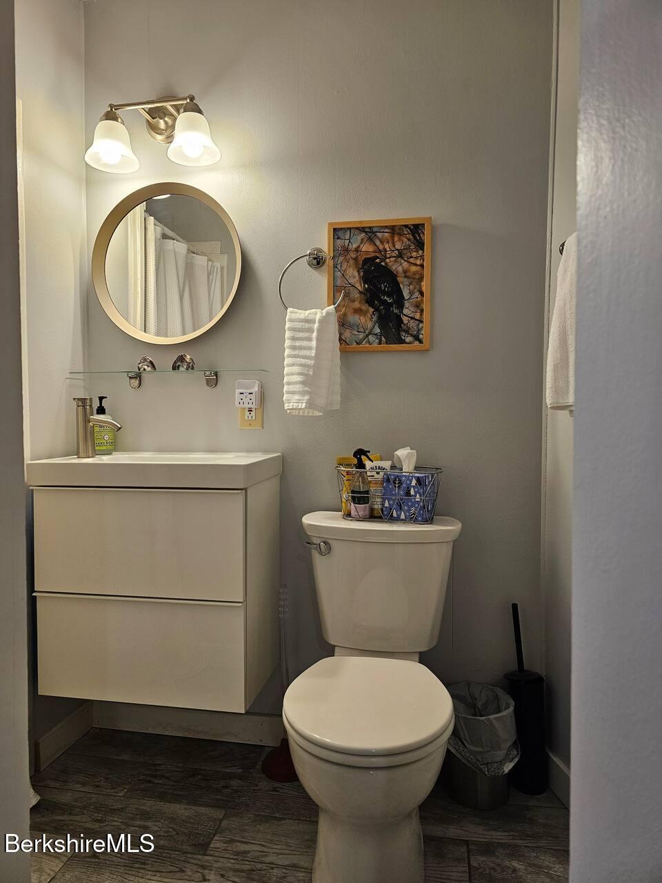 19 Church Street, Unit 10 North Adams, MA 01247 - Photo 15 of 15 a bathroom with a toilet sink and mirror