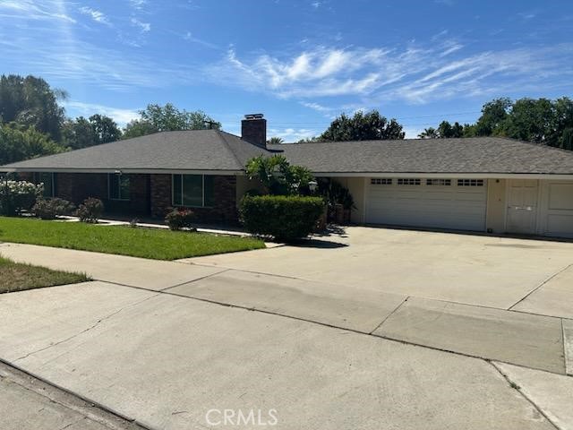2145 Fairview Avenue Riverside, CA 92506 - Photo 1 of 35 a front view of a house with a yard