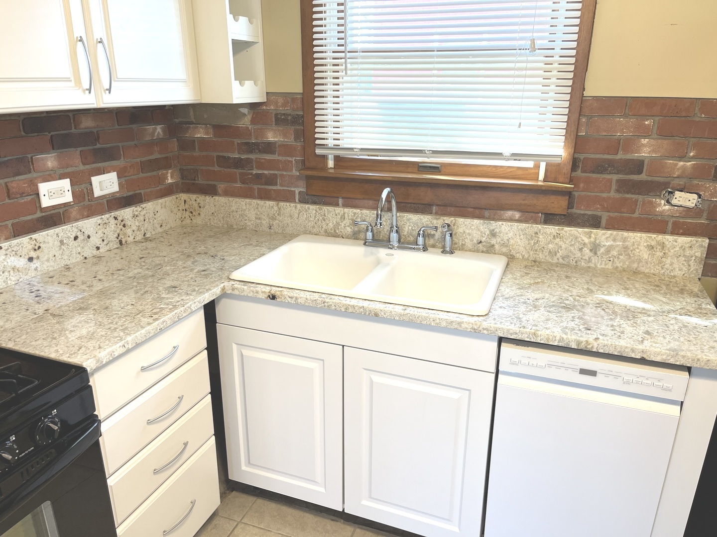 269 Blackhawk Drive Park Forest, IL 60466 - Photo 12 of 21 a kitchen with granite countertop white cabinets and sink