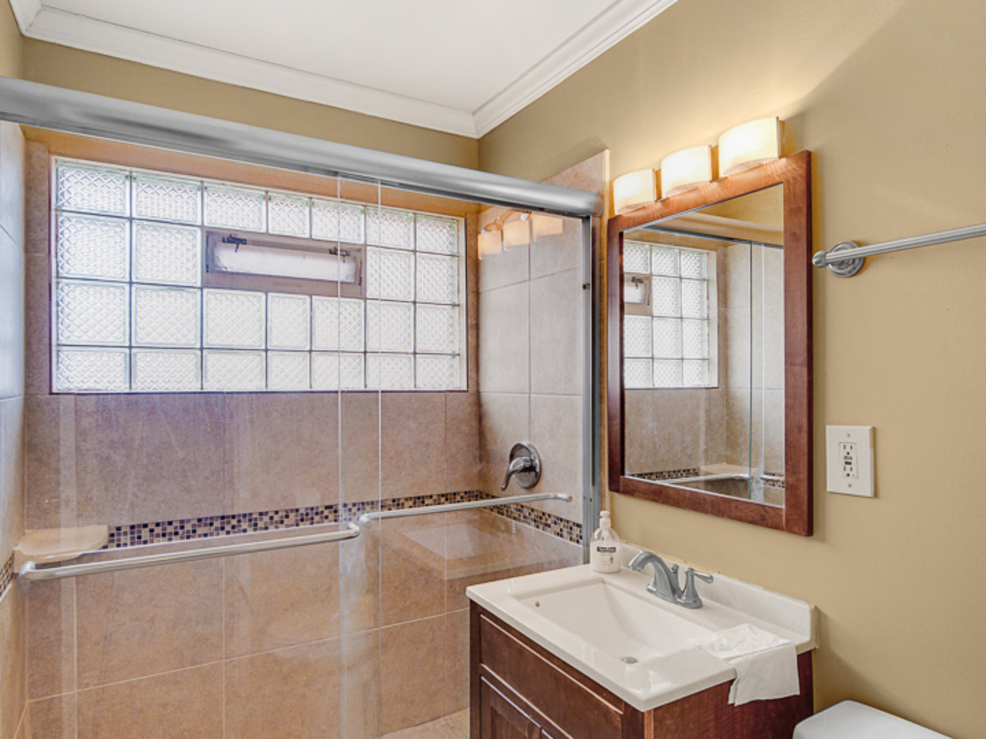 269 Blackhawk Drive Park Forest, IL 60466 - Photo 14 of 21 a bathroom with a sink mirror and a shower