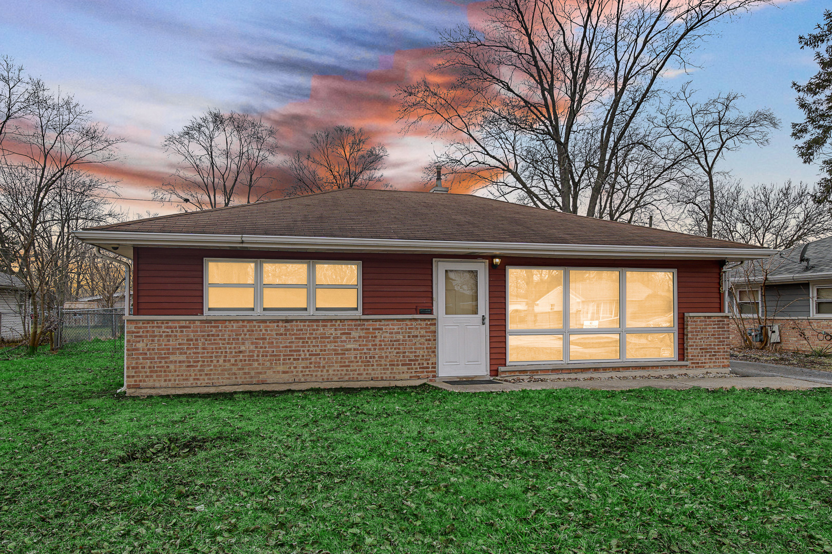 269 Blackhawk Drive Park Forest, IL 60466 - Photo 2 of 21 a front view of a house with a yard and outdoor seating