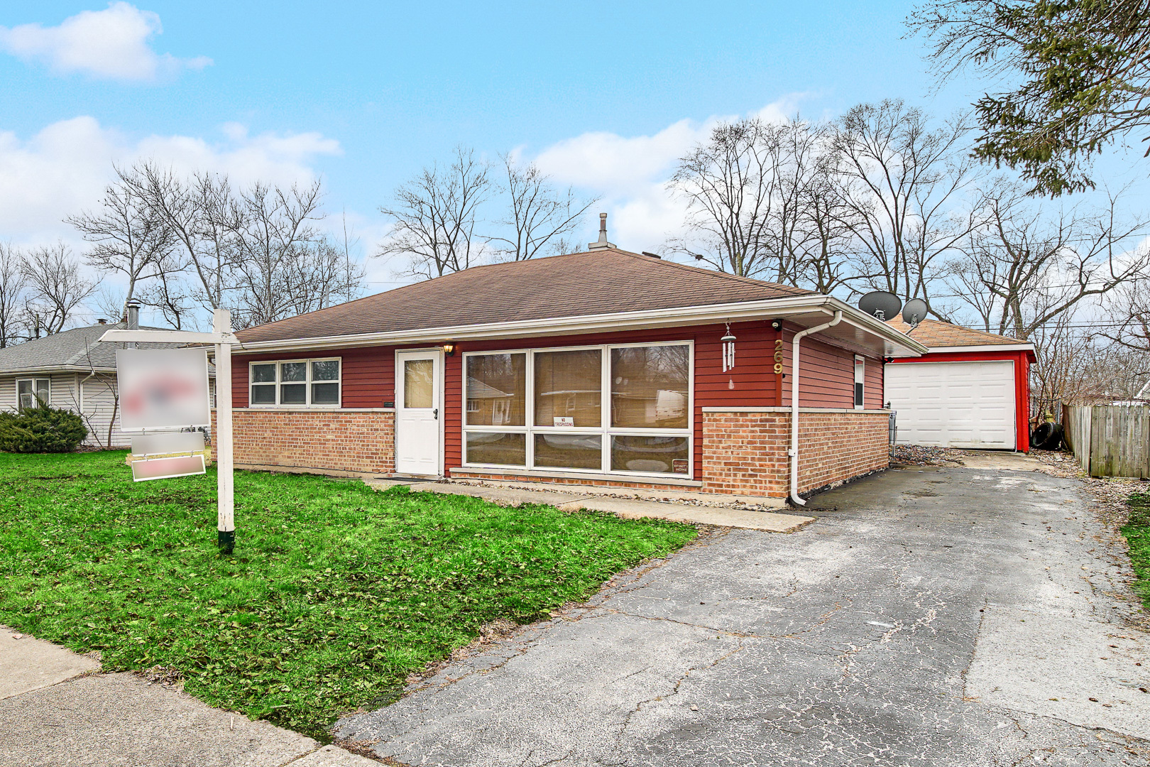 269 Blackhawk Drive Park Forest, IL 60466 - Photo 3 of 21 a front view of a house with a yard