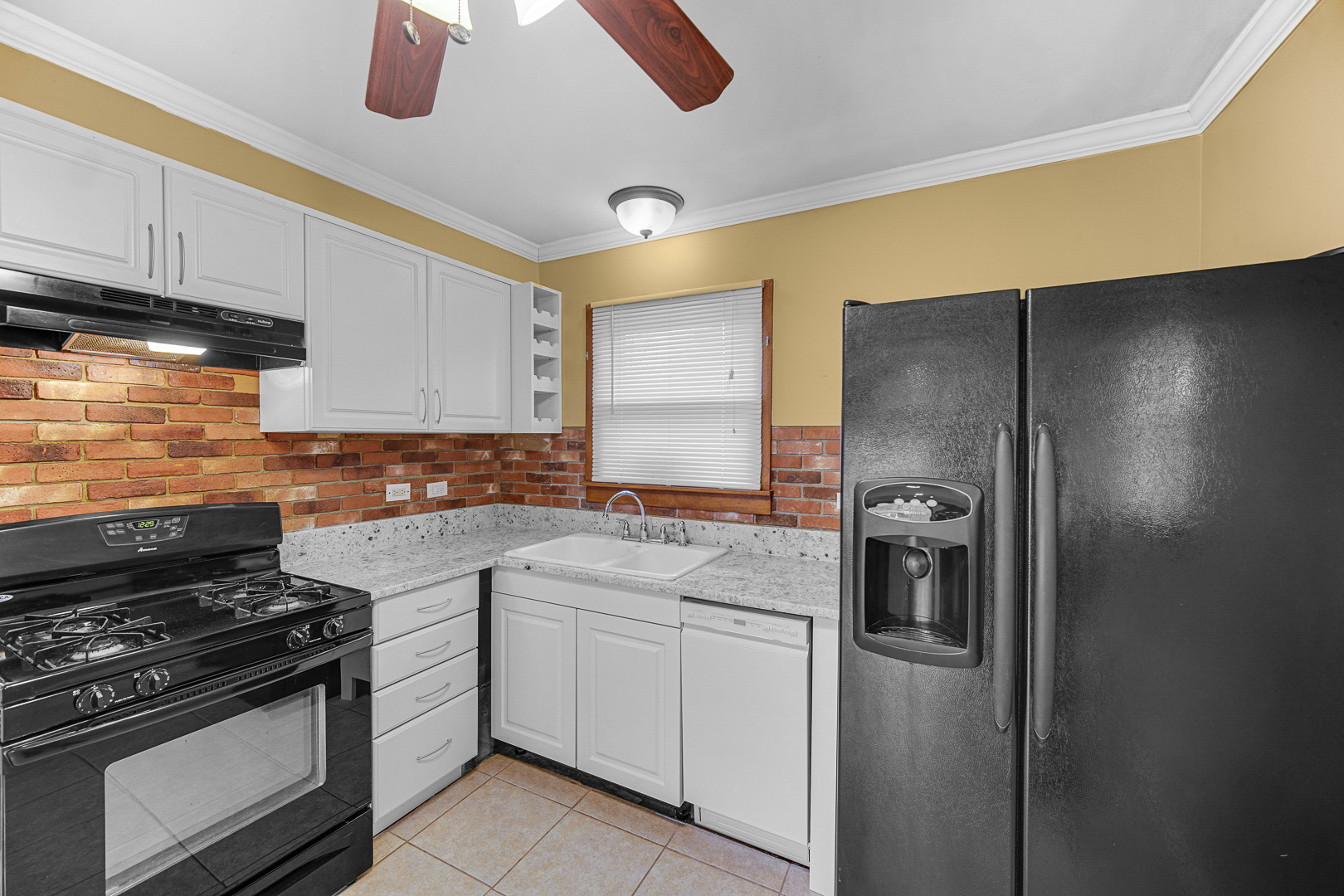 269 Blackhawk Drive Park Forest, IL 60466 - Photo 10 of 21 a kitchen with cabinets and appliances
