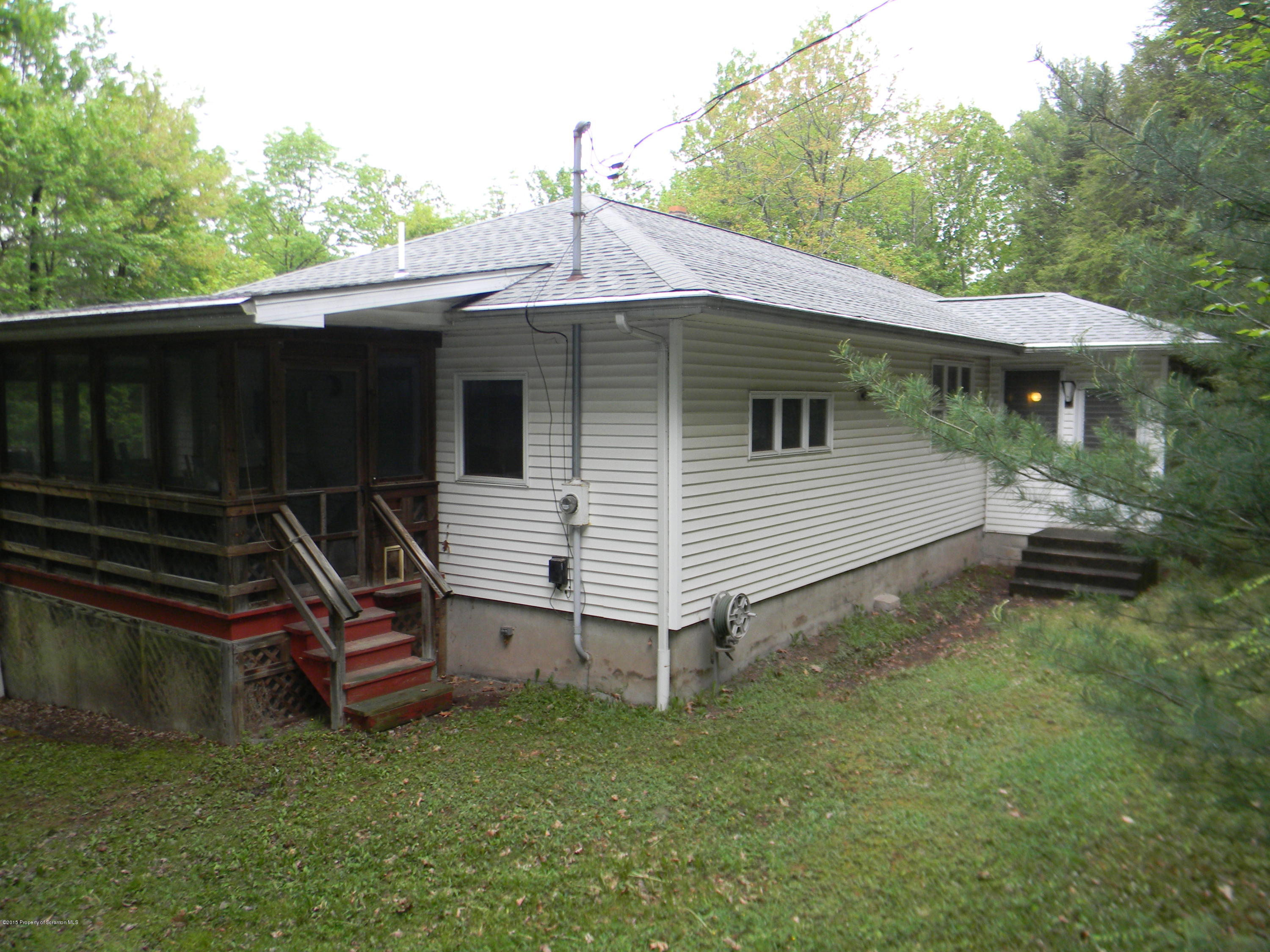 549 Fairview Road Dalton, PA 18414 - Photo 1 of 26 a backyard of a house with table and chairs