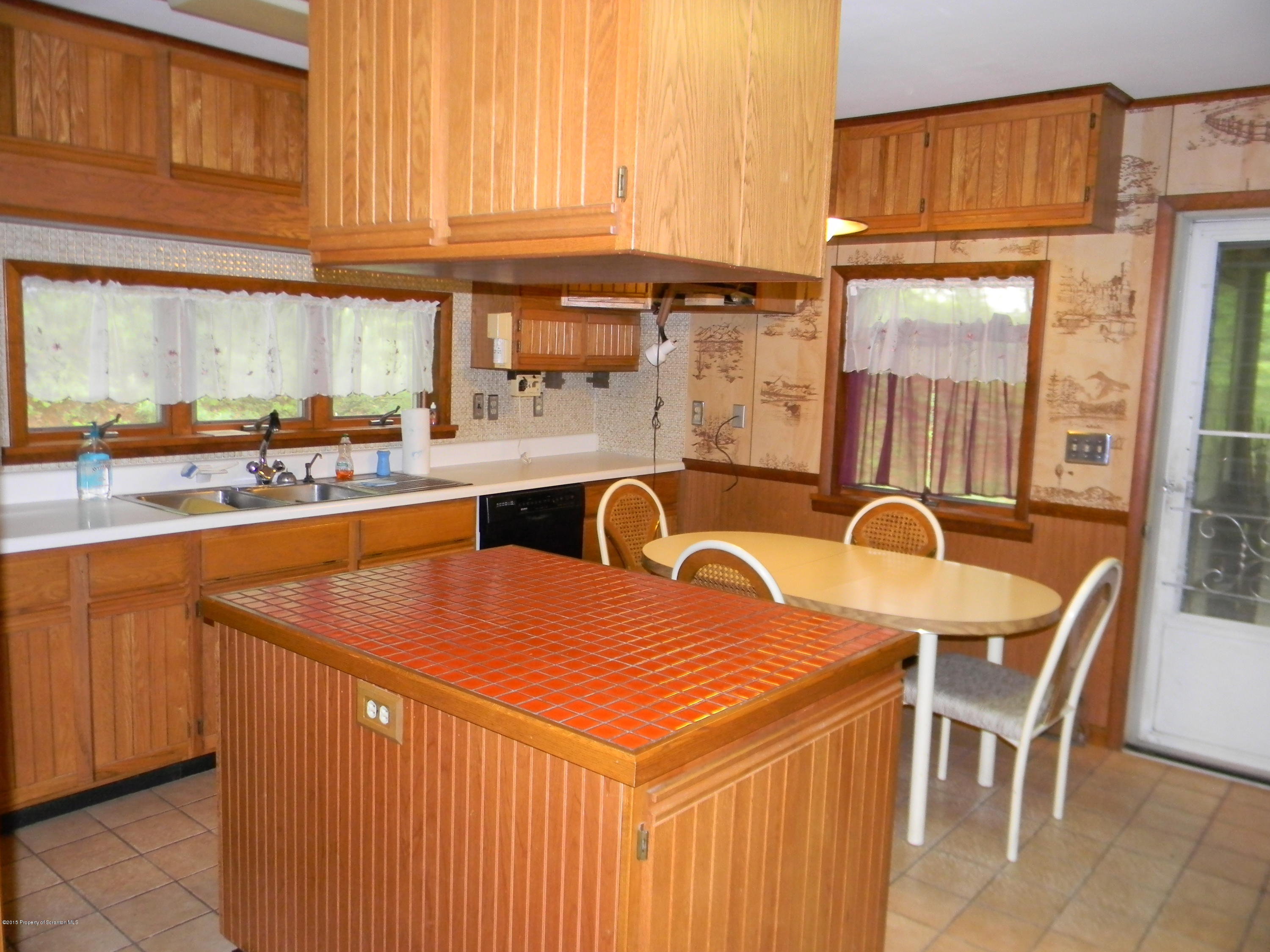 549 Fairview Road Dalton, PA 18414 - Photo 11 of 26 a dining table with chairs and window