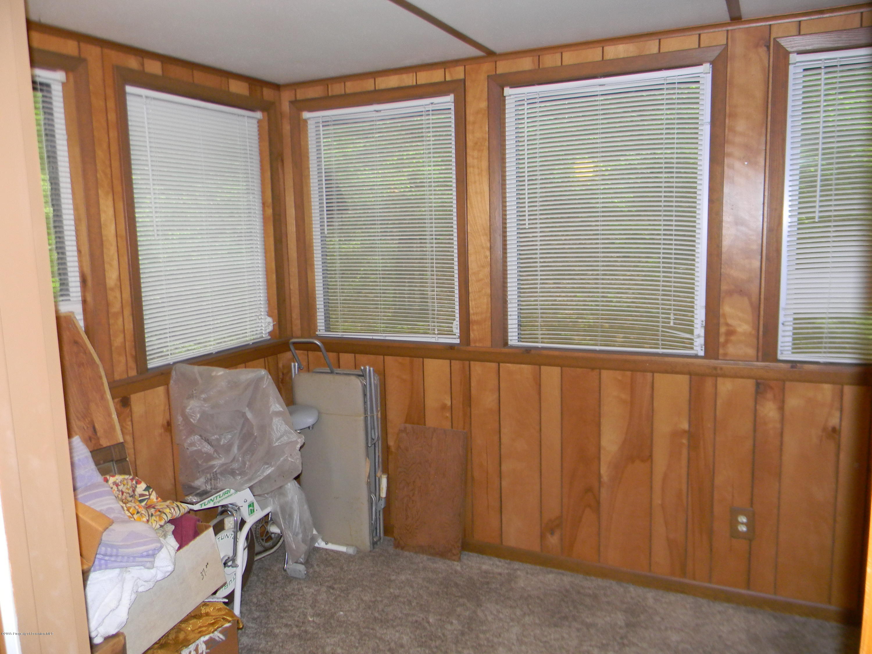 549 Fairview Road Dalton, PA 18414 - Photo 16 of 26 a view of a door and chair in a room