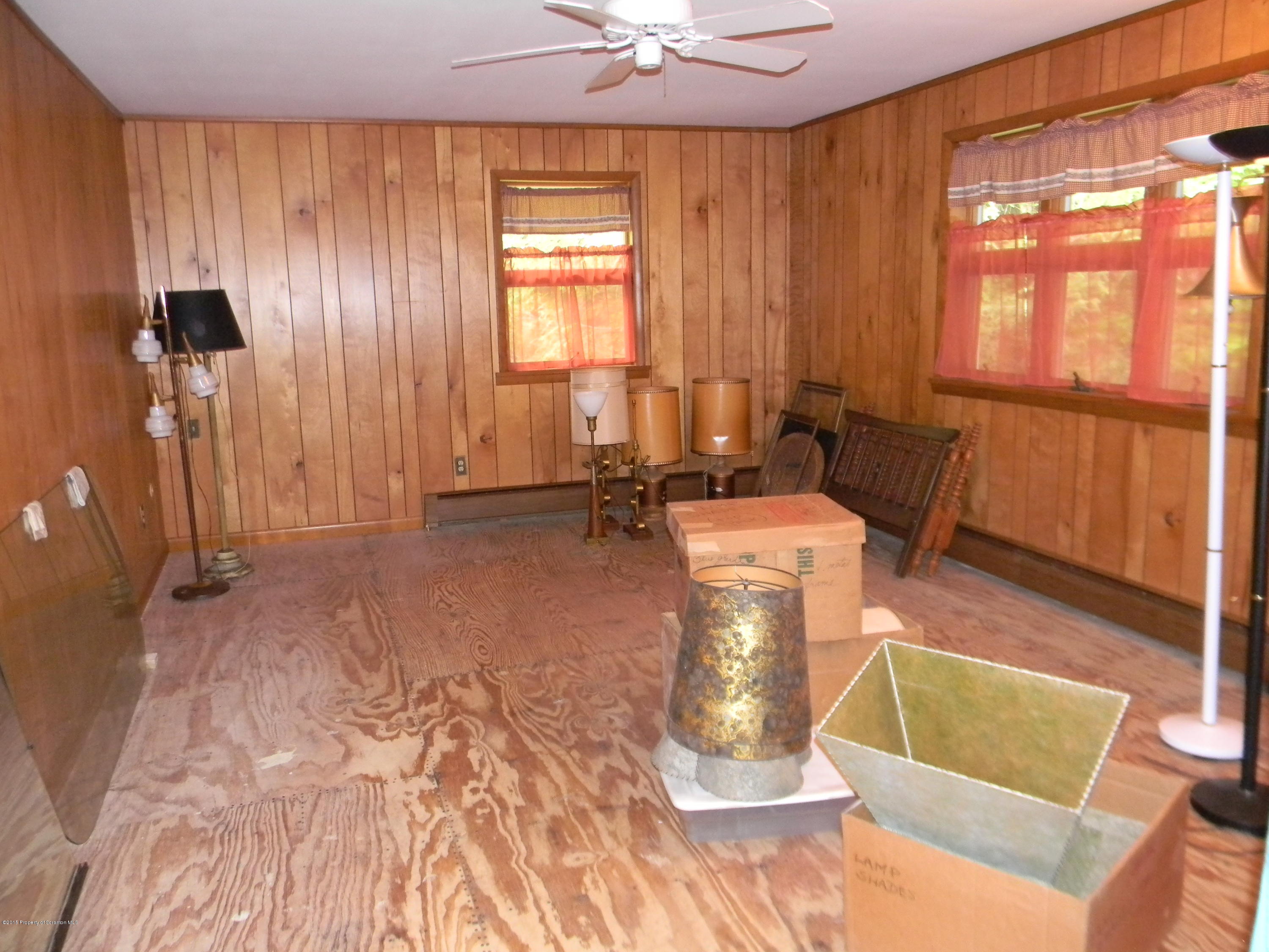 549 Fairview Road Dalton, PA 18414 - Photo 18 of 26 a living room with a couch and a table