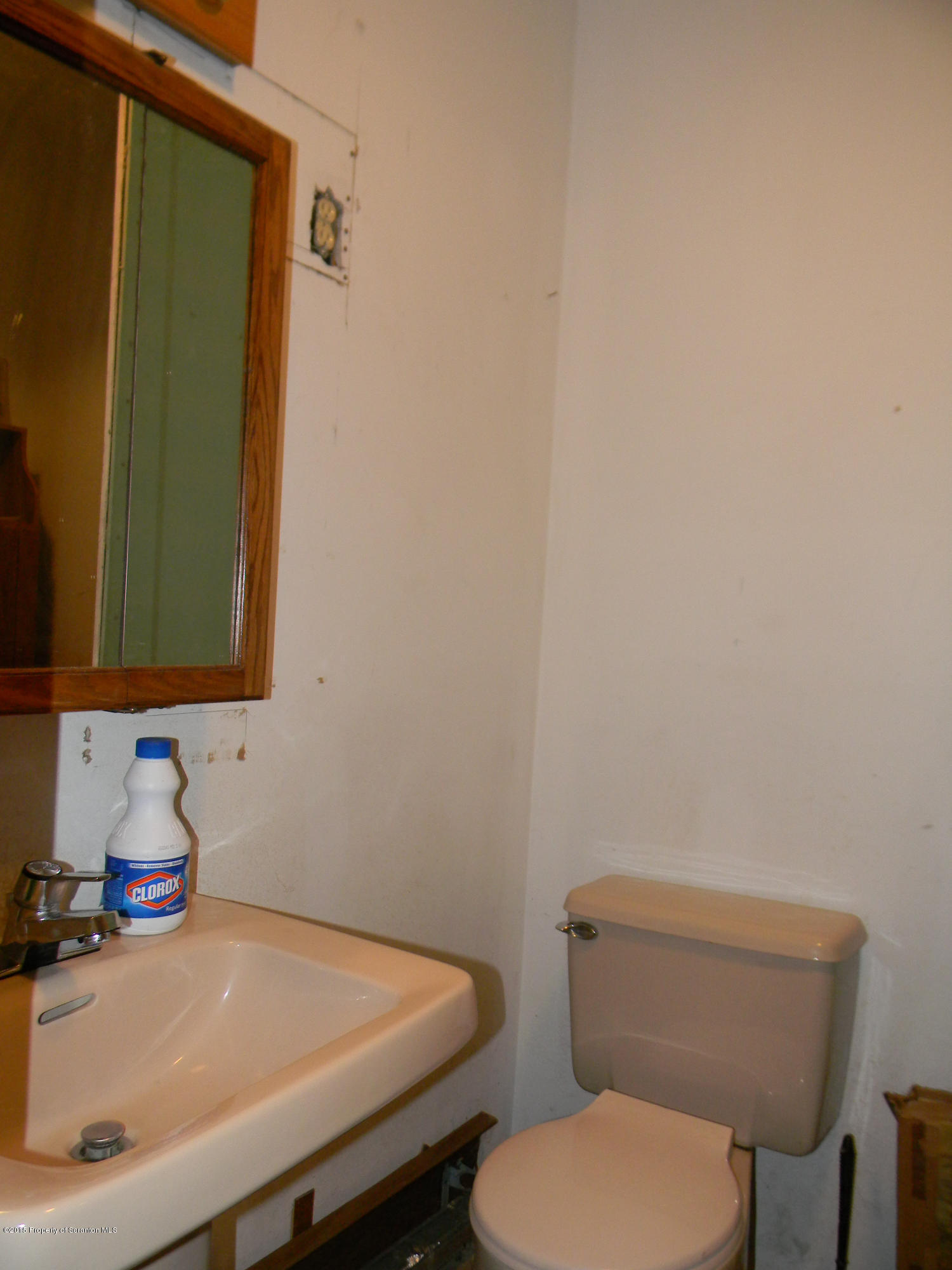 549 Fairview Road Dalton, PA 18414 - Photo 23 of 26 a bathroom with a sink a toilet and mirror