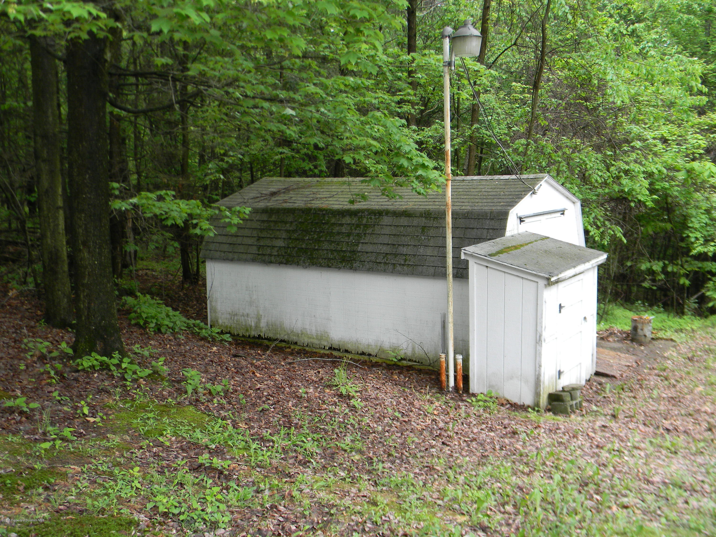 549 Fairview Road Dalton, PA 18414 - Photo 9 of 26 a view of a small house in the middle of a yard