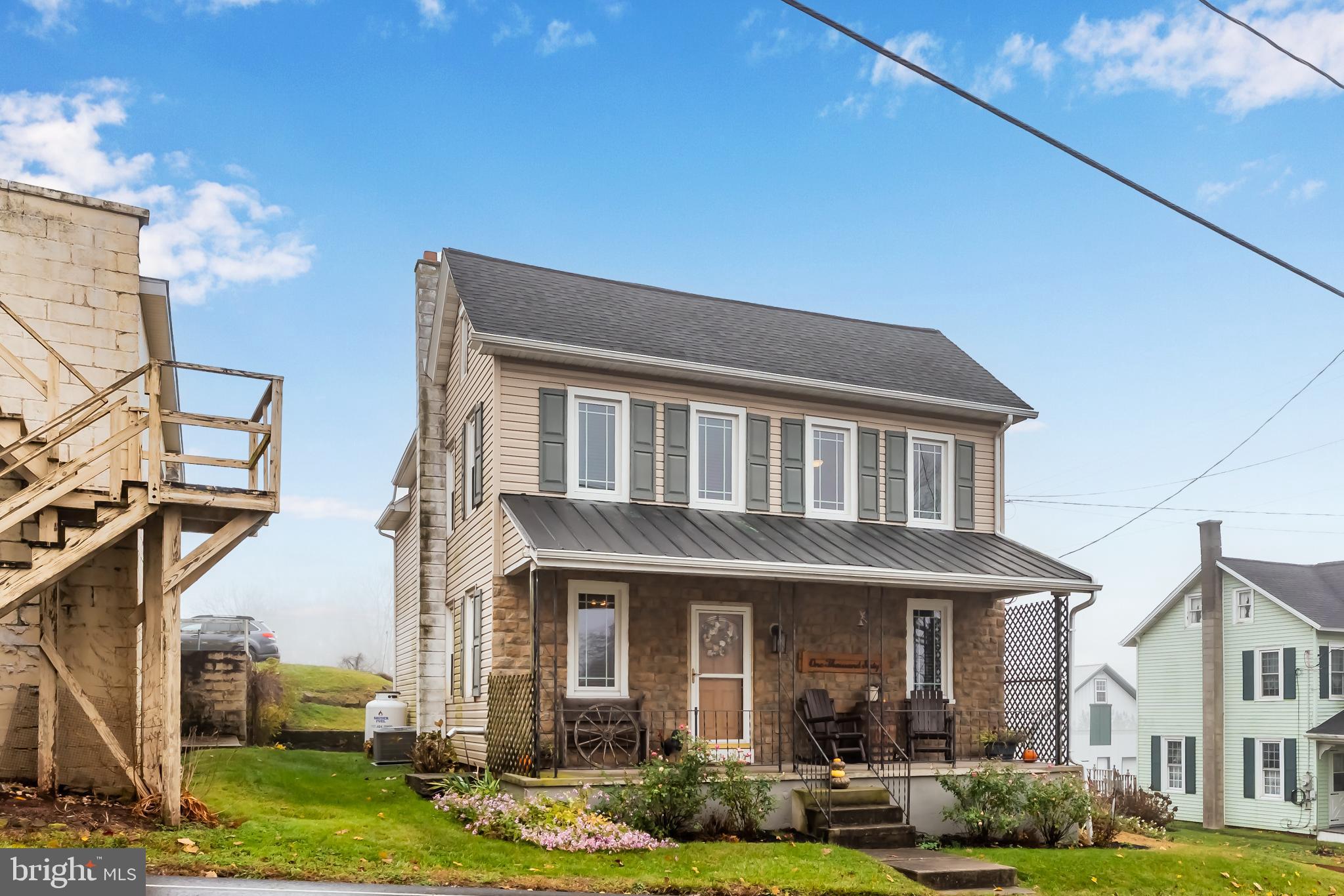 1060 Dry Tavern Road Denver, PA 17517 - Photo 1 of 30 a front view of a house with garden