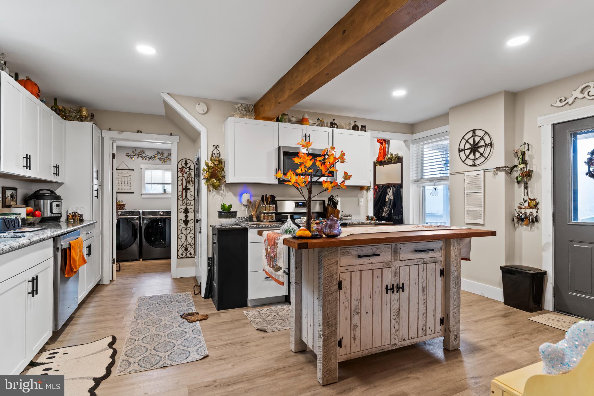 1060 Dry Tavern Road Denver, PA 17517 - Photo 11 of 30 a kitchen with stainless steel appliances granite countertop a refrigerator a stove top oven and a sink