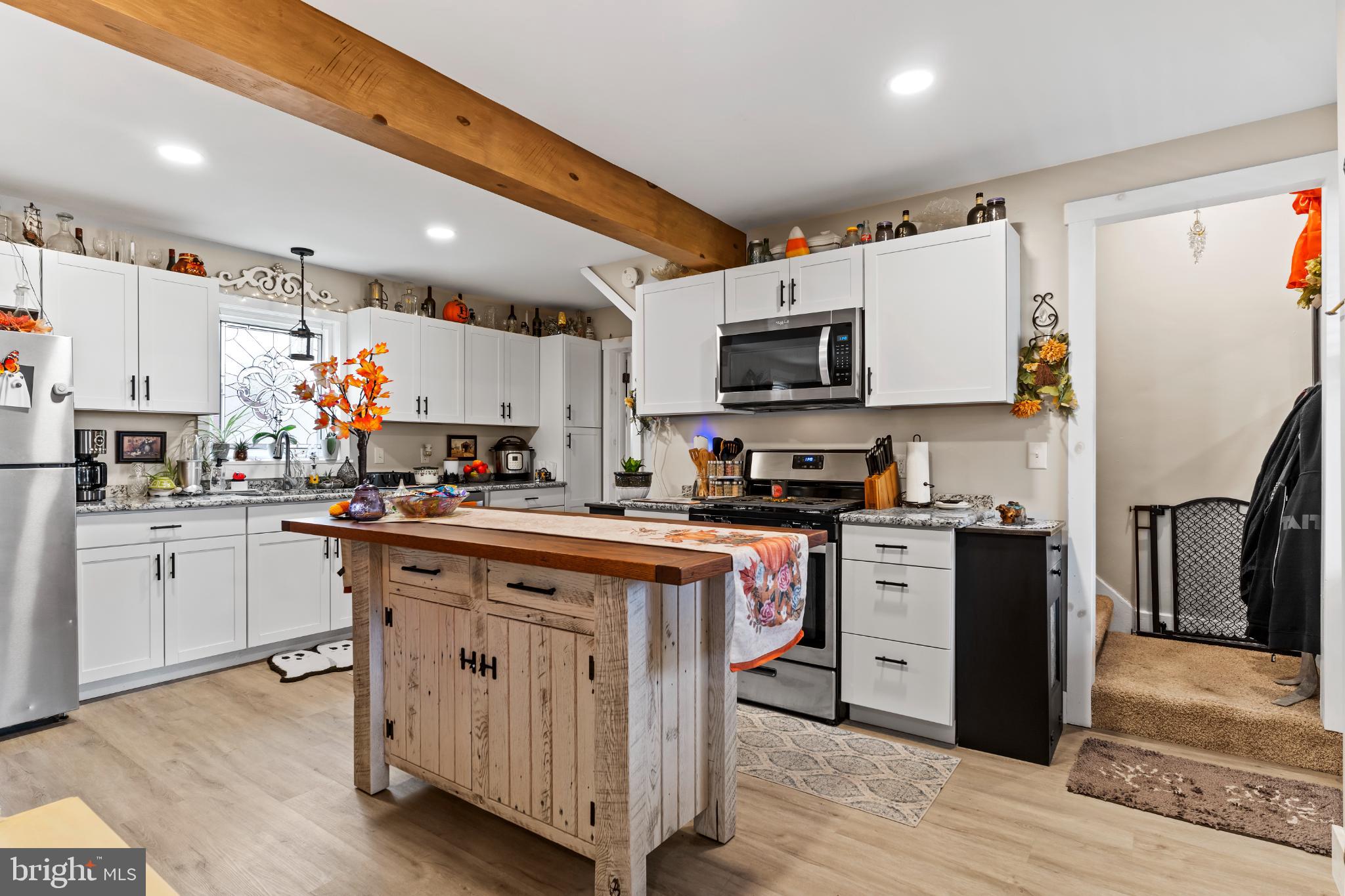 1060 Dry Tavern Road Denver, PA 17517 - Photo 12 of 30 a kitchen with stainless steel appliances granite countertop a refrigerator sink and microwave