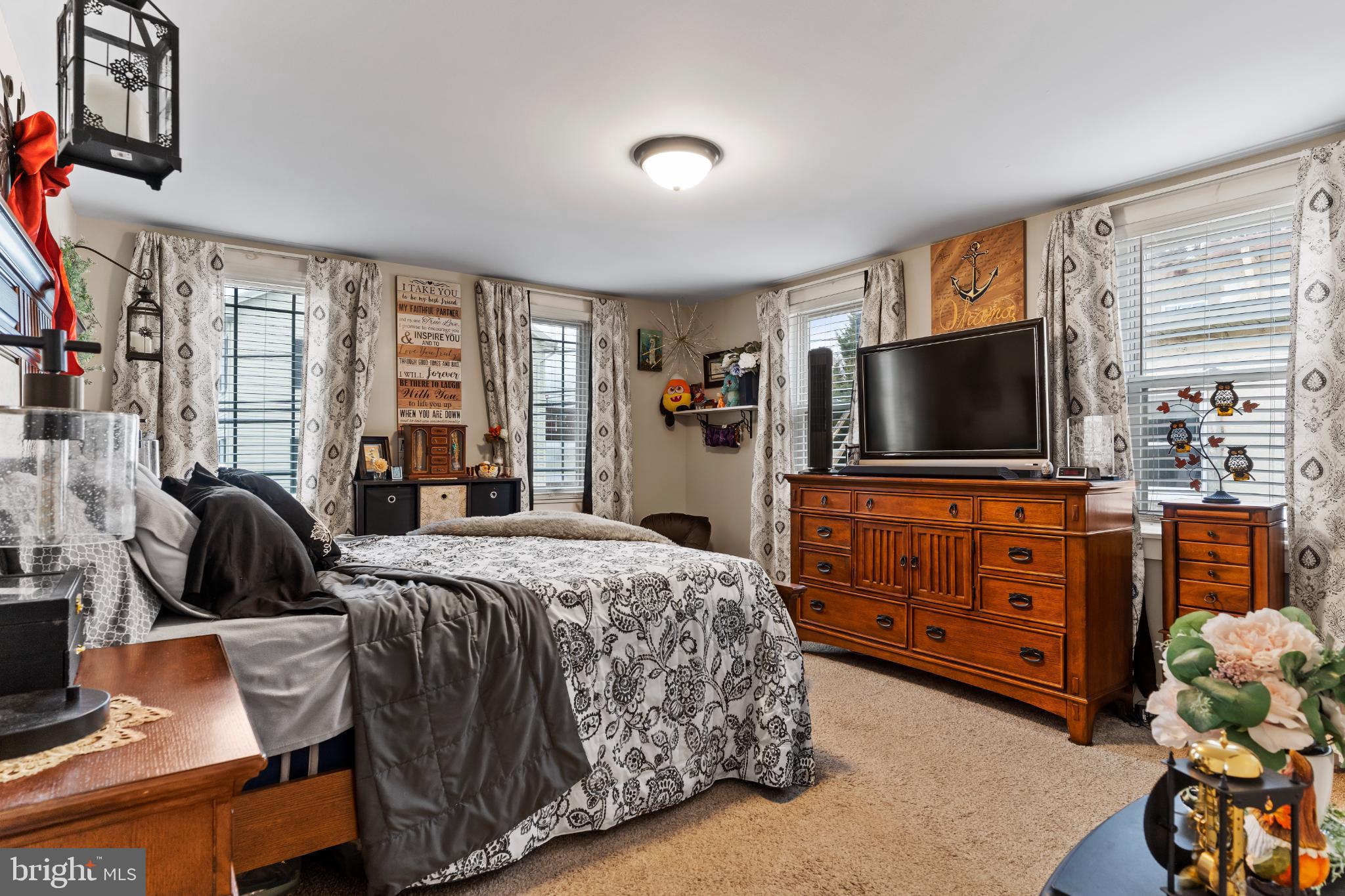 1060 Dry Tavern Road Denver, PA 17517 - Photo 15 of 30 a bedroom with a bed and a flat screen tv