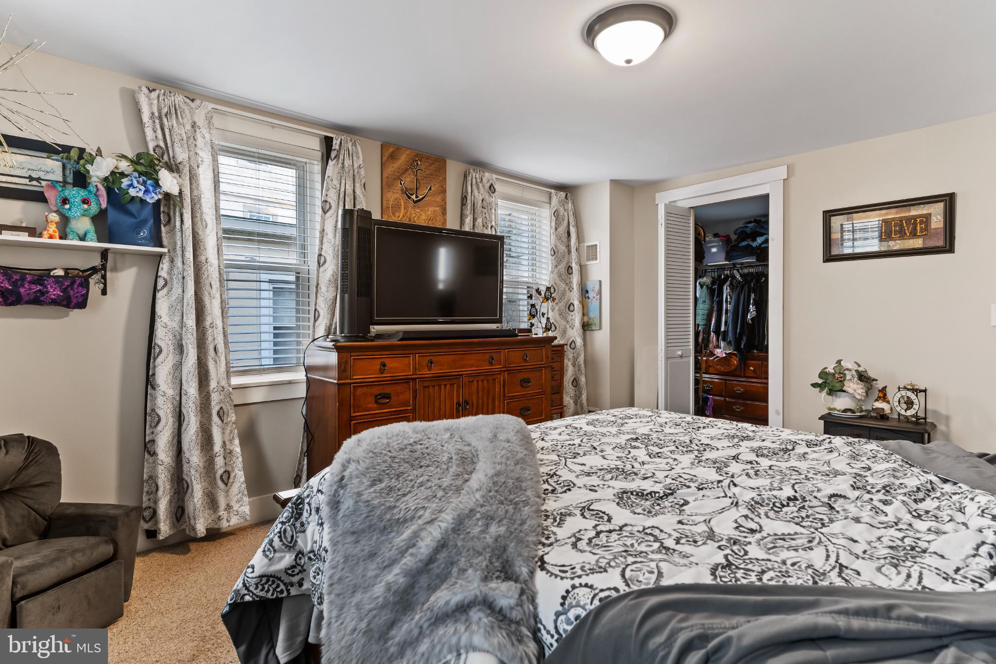 1060 Dry Tavern Road Denver, PA 17517 - Photo 16 of 30 a bedroom with a bed and a flat screen tv