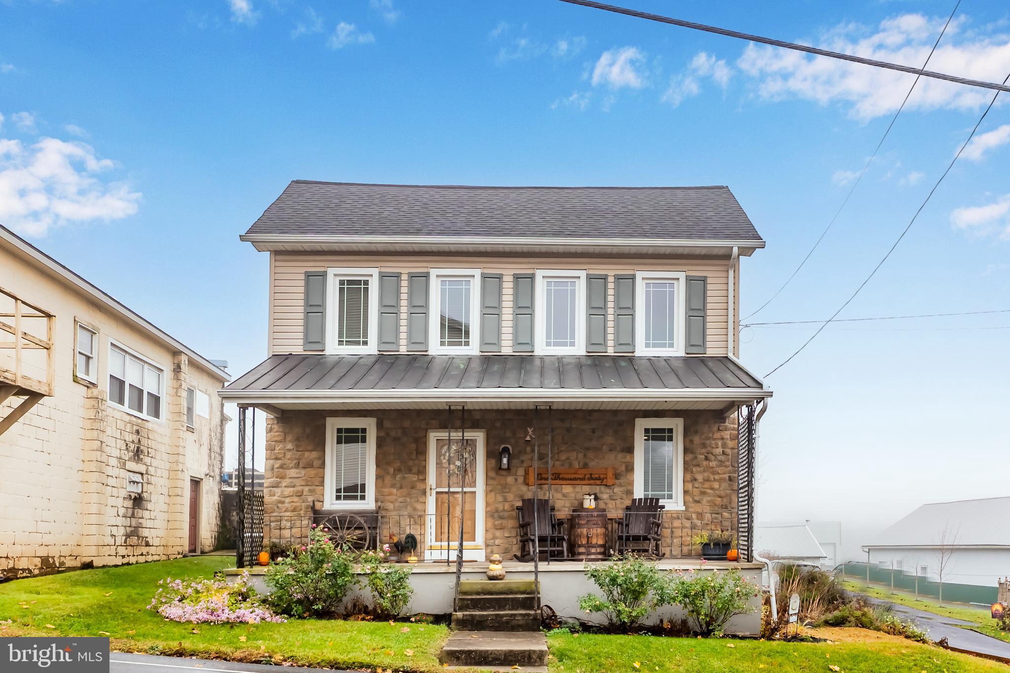 1060 Dry Tavern Road Denver, PA 17517 - Photo 2 of 30 a front view of a house with garden