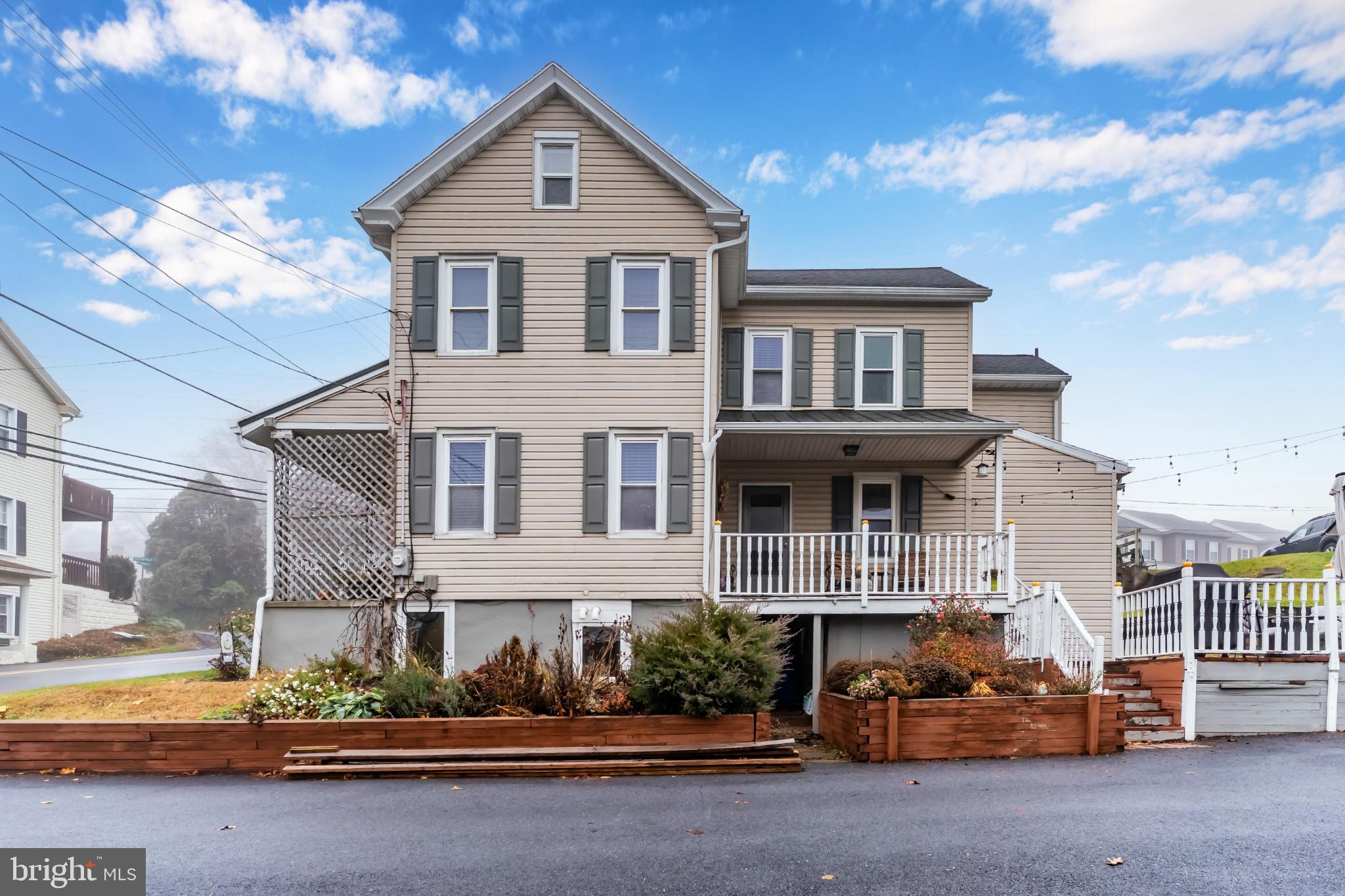 1060 Dry Tavern Road Denver, PA 17517 - Photo 5 of 30 a front view of a house with a yard
