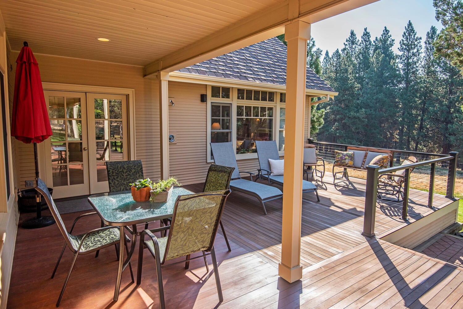 69950 Cowboy Jones Road Sisters, OR 97759 - Photo 45 of 57 Wrap Around Deck and Outdoor Dining Area