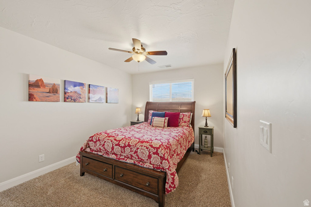4269 Razor Drive Washington, UT 84780 - Photo 23 of 50 Carpeted bedroom featuring ceiling fan and baseboards